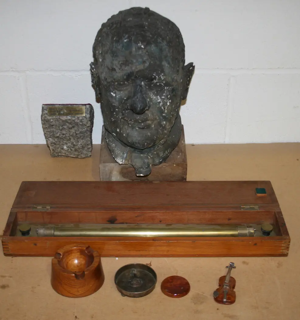 A GRANITE BOOKEND, APPLIED WITH A PLAQUE