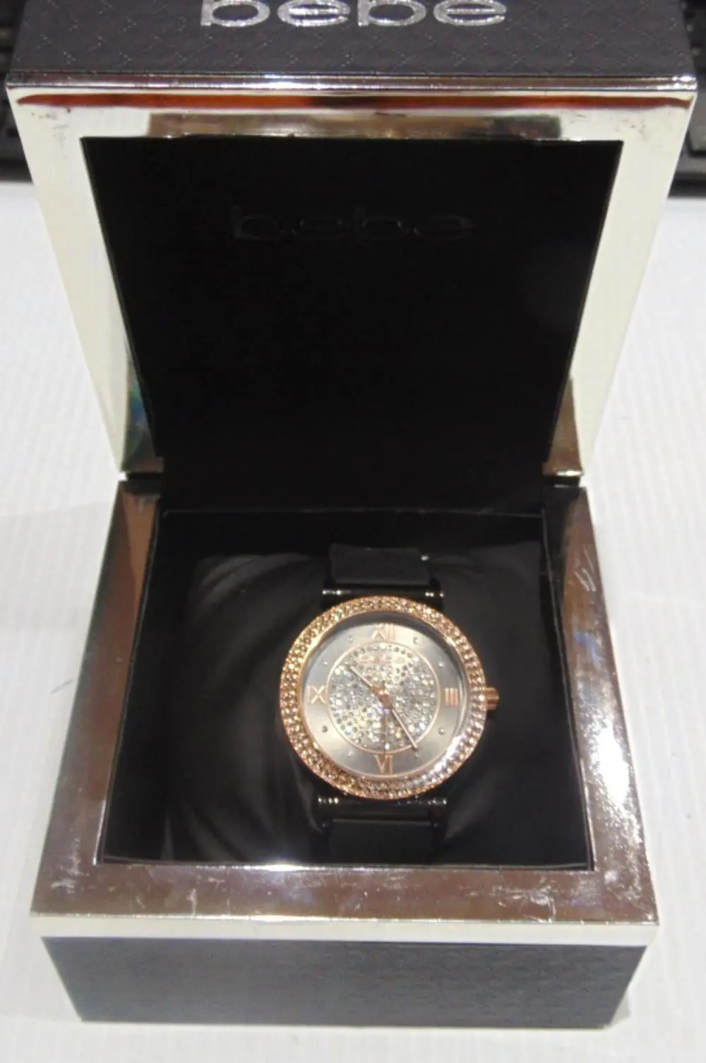 BEBE BLACK AND GOLD CRYSTAL BEZEL WATCH